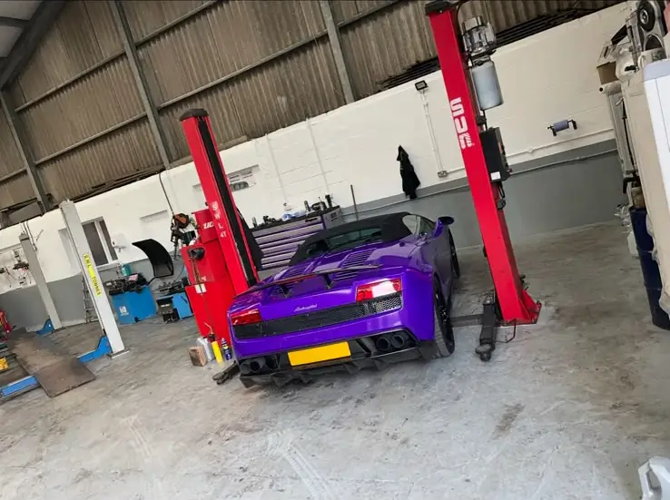 Purple car in the Rhodes Auto Centre workshop in Great Harwood